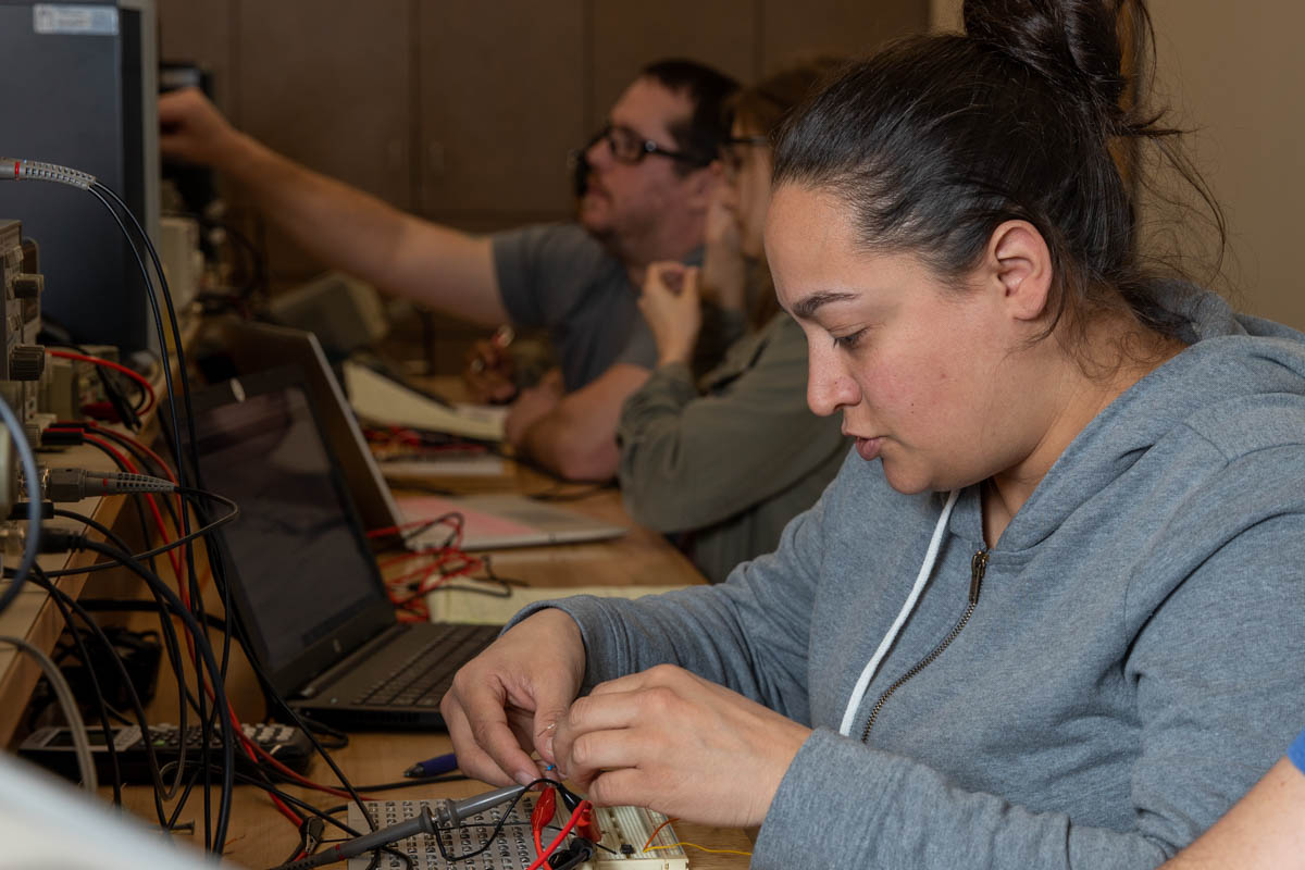 Students working on circuit boards